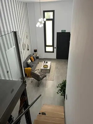 Zona de estar de Apartamentos La Chimenea