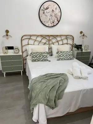 Cama o camas de una habitación en Apartamentos La Chimenea