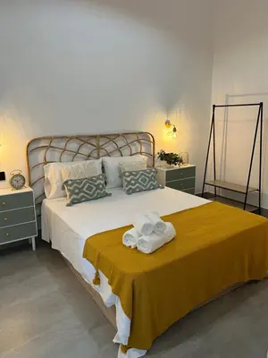 Cama o camas de una habitación en Apartamentos La Chimenea
