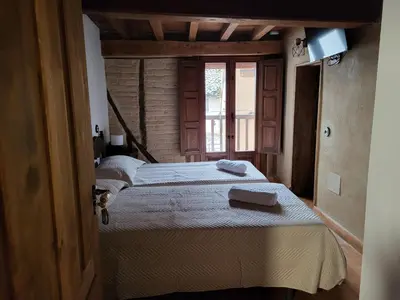 Cama o camas de una habitación en La Casa El Cura