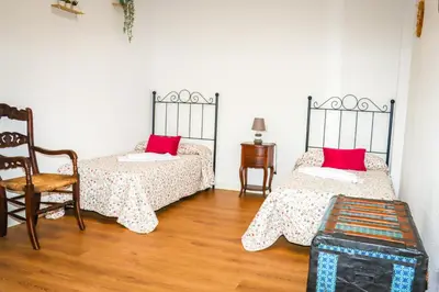 Cama o camas de una habitación en El Patio de los Naranjos