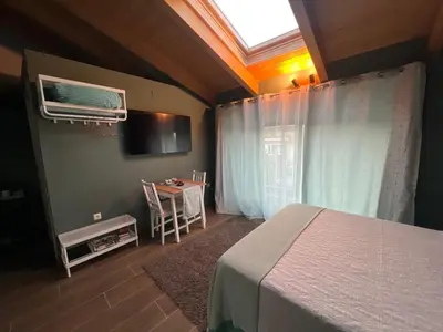 Cama o camas de una habitación en Grupo García de Paredes apartamentos turísticos