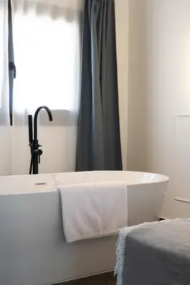 Cama o camas de una habitación en La Antigua Farmacia