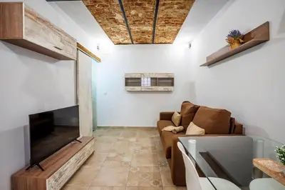 Una televisión o centro de entretenimiento en APARTAMENTO BERROCALA