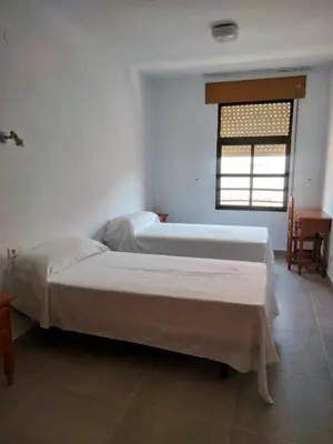 Cama o camas de una habitación en Hostal Extrelucía