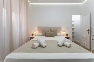 Cama o camas de una habitación en Casa Augusto - junto al Teatro Romano, con garaje