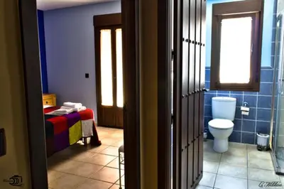Un baño de Apartamentos Rurales El Calama