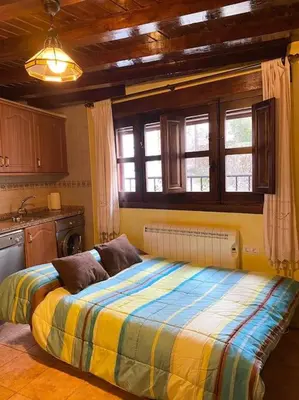 Cama o camas de una habitación en La herradura, acogedora casa en Montemayor del Río