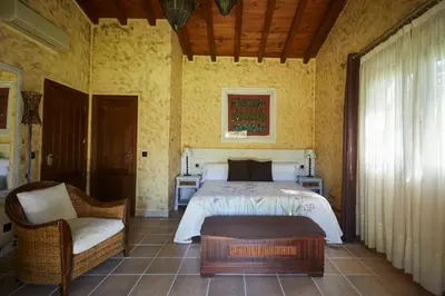 Cama o camas de una habitación en Hotel El Mirlo Blanco