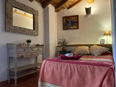 Cama o camas de una habitación en La Candileja