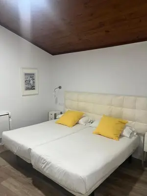 Cama o camas de una habitación en Apartamentos La Encomienda 2 Llaves