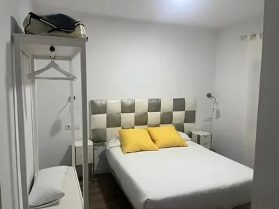 Cama o camas de una habitación en Apartamentos La Encomienda 2 Llaves