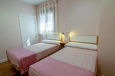 Cama o camas de una habitación en ALOJAMIENTOS TAJO INTERNACIONAL
