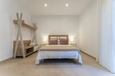Cama o camas de una habitación en CMDreams Platinium- Apartamentos turísticos en el centro de Mérida