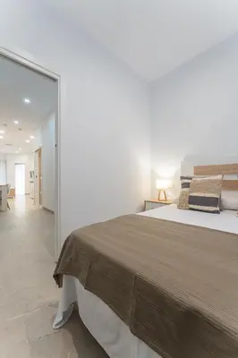 Cama o camas de una habitación en CMDreams Platinium- Apartamentos turísticos en el centro de Mérida