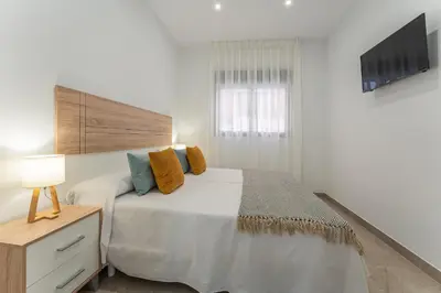 Cama o camas de una habitación en CMDreams Platinium- Apartamentos turísticos en el centro de Mérida