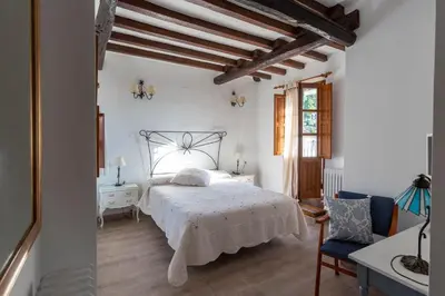 Cama o camas de una habitación en El Jardín del Laurel - only adults -