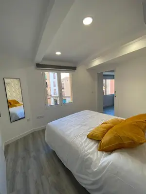 Cama o camas de una habitación en Apartamentos San Martín