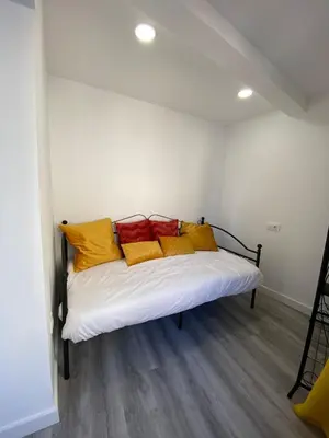 Cama o camas de una habitación en Apartamentos San Martín
