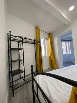 Cama o camas de una habitación en Apartamentos San Martín