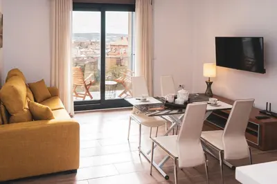 Una televisión o centro de entretenimiento en Alojamientos VEN -Vista Extremadura Norte