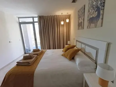 Cama o camas de una habitación en La Alameda Jardines del Prado -Amplio y con ascensor-