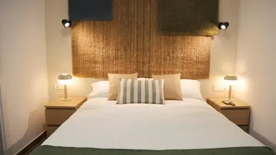 Cama o camas de una habitación en HOTEL LOS ALAMOS BOUTIQUE