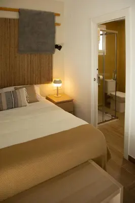 Cama o camas de una habitación en HOTEL LOS ALAMOS BOUTIQUE