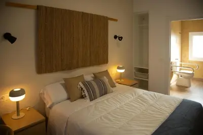 Cama o camas de una habitación en HOTEL LOS ALAMOS BOUTIQUE