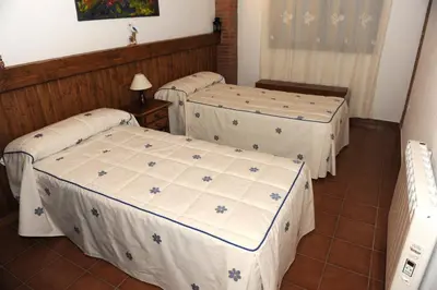 Cama o camas de una habitación en Apartamentos Rurales Monfragüe
