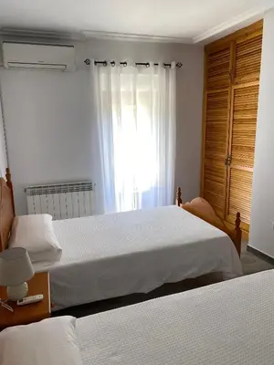 Cama o camas de una habitación en TRES COLUMNAS