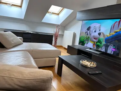 Una televisión o centro de entretenimiento en Apartamento Gran Vía - PARKING GRATIS