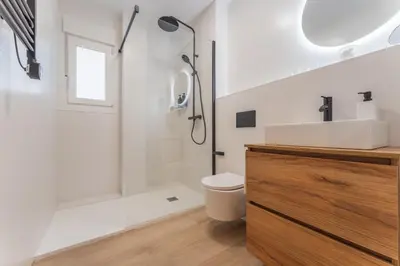 Un baño de Apartamentos Turísticos Jardín del Albarregas