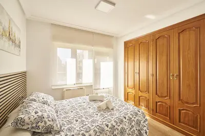 Cama o camas de una habitación en Precioso alojamiento Barrio del Oeste