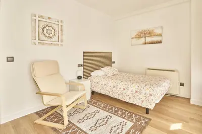 Cama o camas de una habitación en Precioso alojamiento Barrio del Oeste