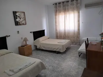 Cama o camas de una habitación en Hostal Restaurante El Labrador