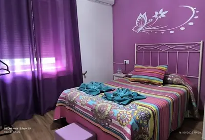 Cama o camas de una habitación en Hostal Hotel EL Chato
