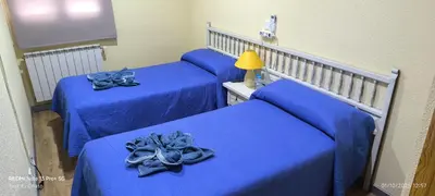 Cama o camas de una habitación en Hostal Hotel EL Chato