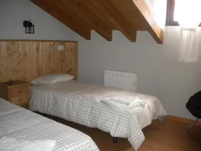 Cama o camas de una habitación en Hostal Rural Las Cuatro Calles