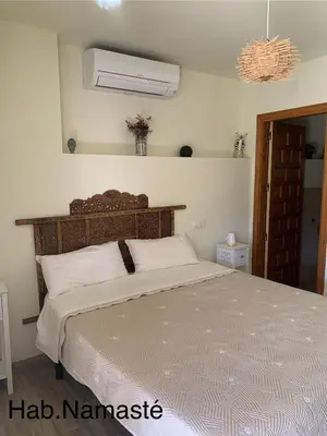 Cama o camas de una habitación en CASA PARVATHI CANDELEDA