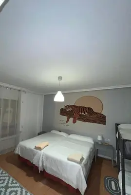 Cama o camas de una habitación en Roomin Hostel