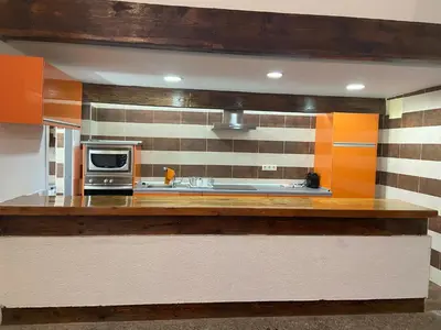 Una cocina o zona de cocina en La Herradura De San Pedro