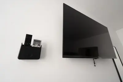 Una televisión o centro de entretenimiento en Apartamentos GEMINA