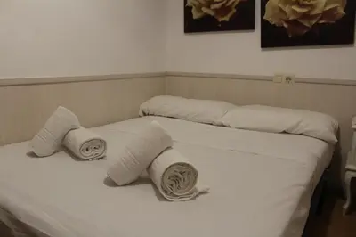 Cama o camas de una habitación en Aires de gredos/bajo