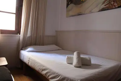 Cama o camas de una habitación en Aires de gredos/bajo