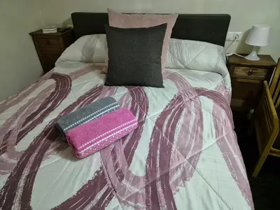 Cama o camas de una habitación en La Casita del Arco de San Andrés