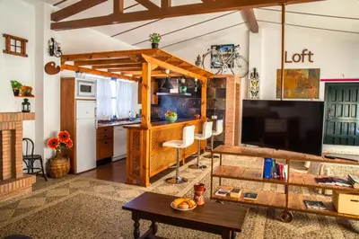 Una televisión o centro de entretenimiento en Apartamento Loft La Encina