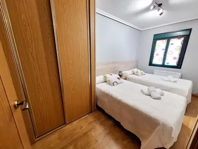 Cama o camas de una habitación en Apartamento Turístico El Canalizo I