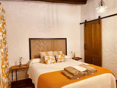Cama o camas de una habitación en Complejo Rural Los Molinos