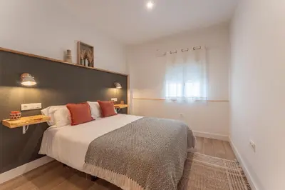 Cama o camas de una habitación en Apartamento Turístico KHöALA HOME